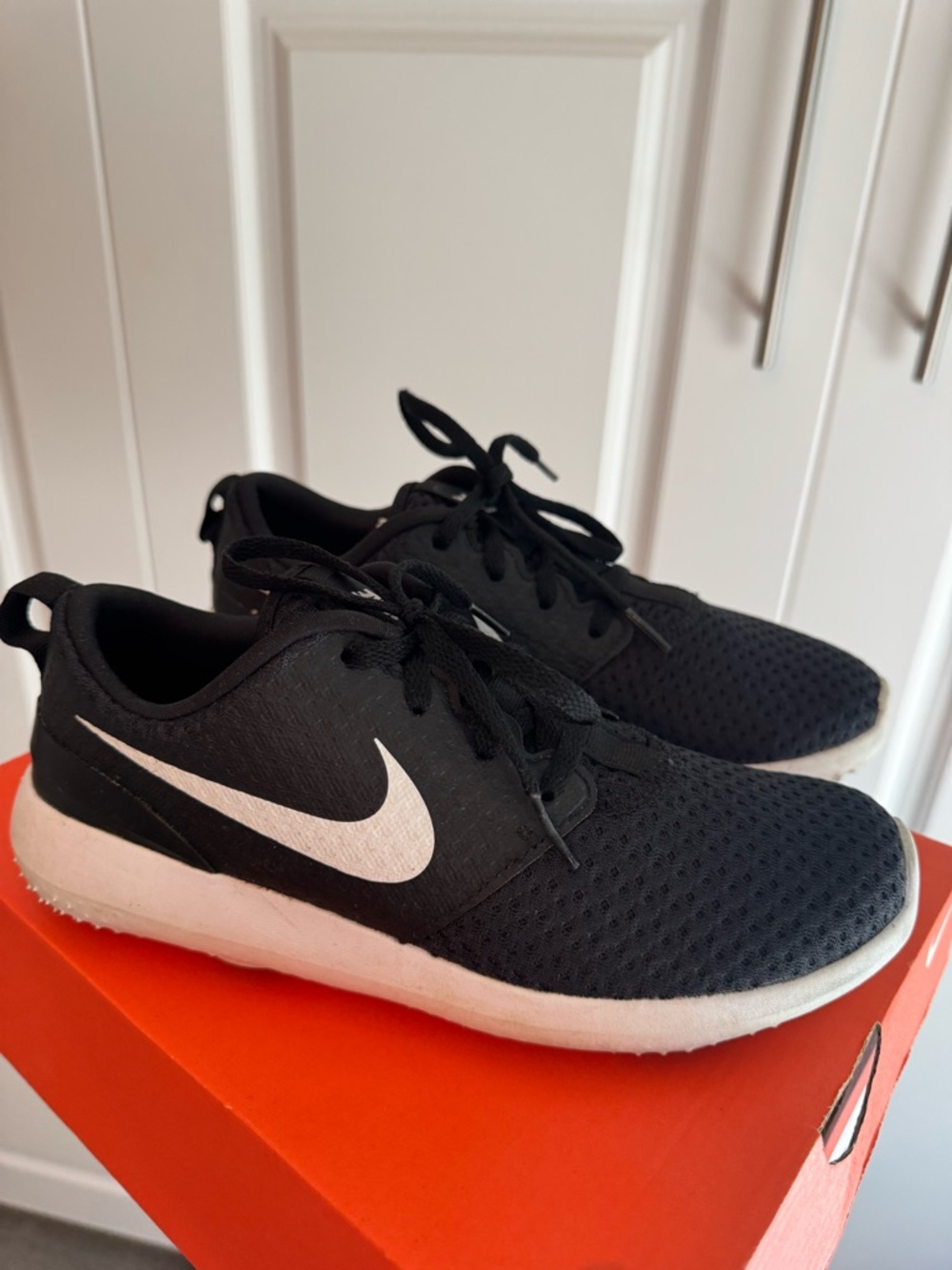 Nike Black and White Youth Golf Sneakers with Mesh Upper and Sleek Silhouette